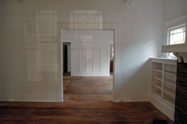 View to dining room and built-in bookshelf.