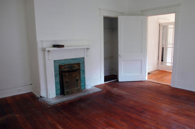 Coal fire place, closet and door to office/front bedroom.