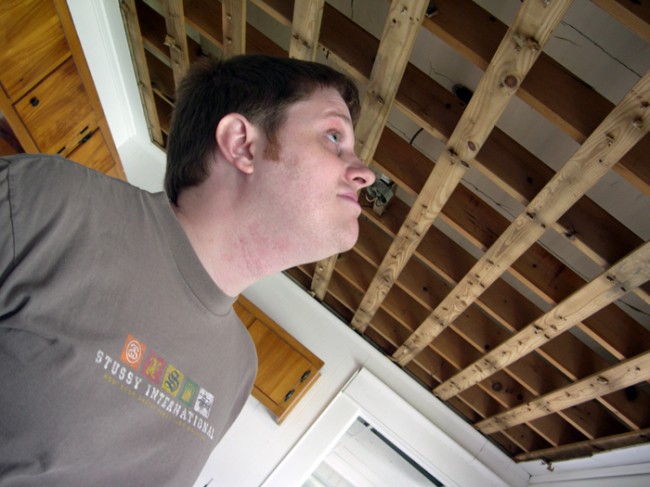 Patrick examining the hardcore built drop-ceiling structure.