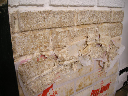 Continuing Peel Away Process on Fireplace - Westview Bungalow