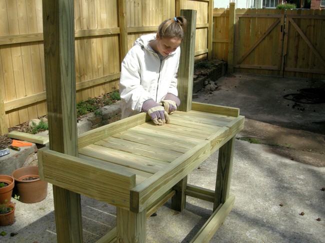 Steffi inserting the boards for the work surface.