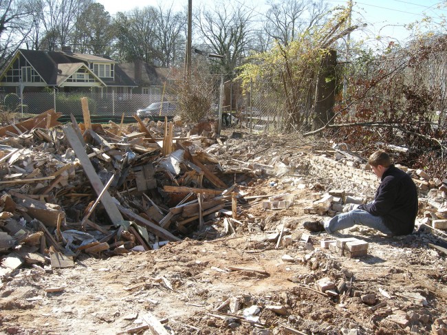 Collecting bricks from the KIPP Strive construction site. Removing mortar is hard work.