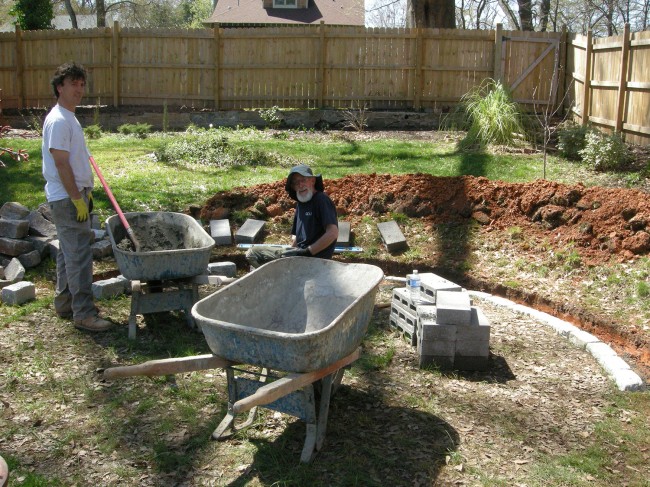 Ray and Chipper laying the foundation for the wall.