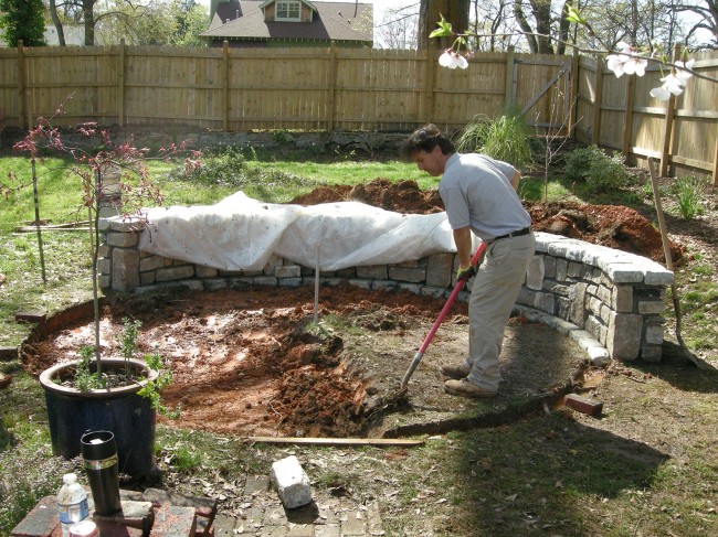 Chipper dug a giant hole for the granite dust to support the brick patio.