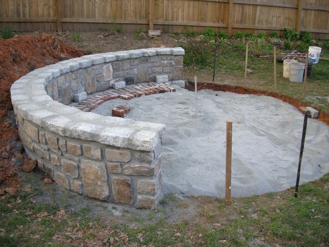 A ton of granite dust filled up the hole to create the foundation for the patio. Lots of strings and levels were used to make sure everything was nice and flat.